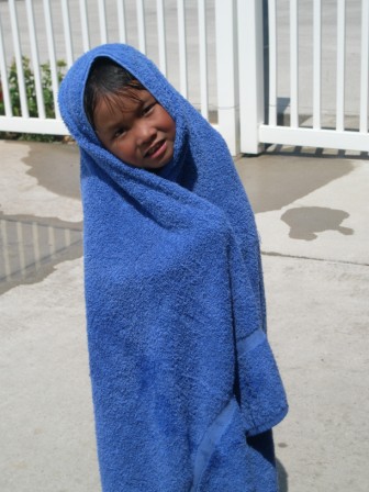 Kasen wrapped in a beach towel